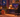 Cozy Halloween desk setup with Dowinx QL-66B3 black chair, pumpkins, candlelight, and autumn decor